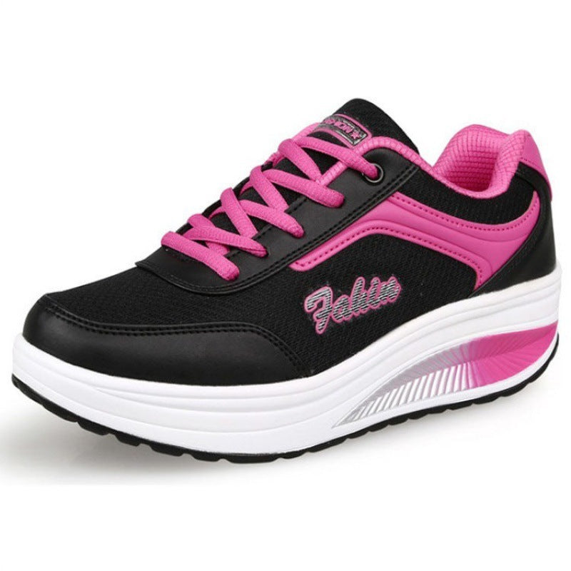 Women’s lace-up athletic shoe, black upper with pink trim and thick white midsole