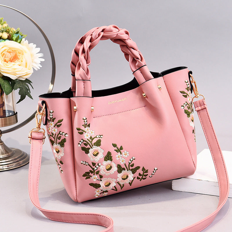 Floral PU handbag tote in blush pink with braided top handles and crossbody strap