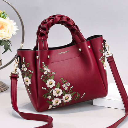 Floral PU handbag tote in wine red with braided handles and crossbody strap