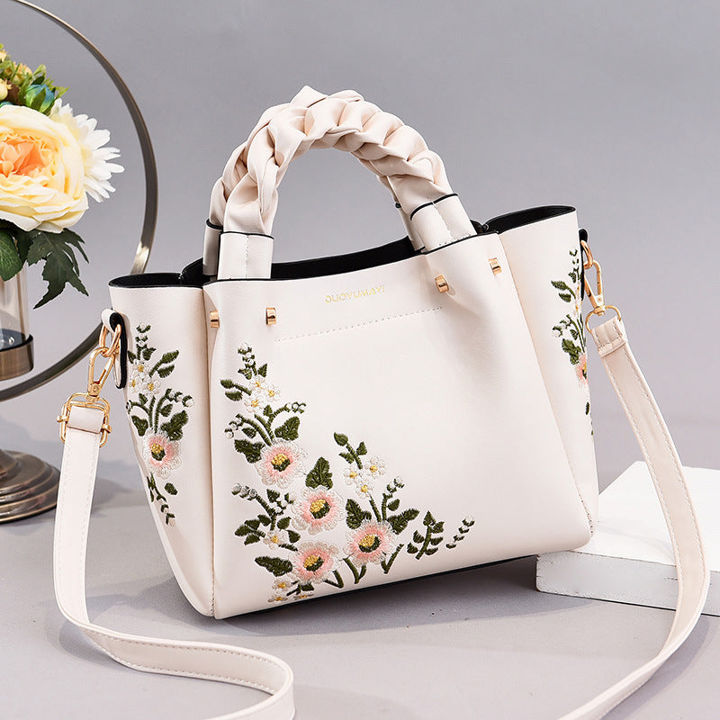 Floral PU handbag tote in cream with braided top handles and crossbody strap