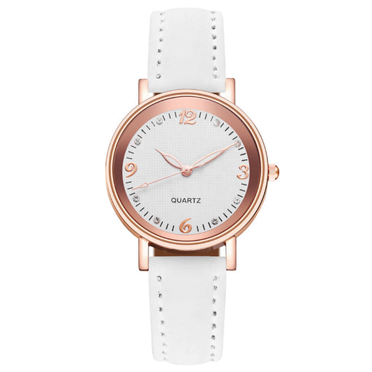 White watch with rose gold case and strap on a white background