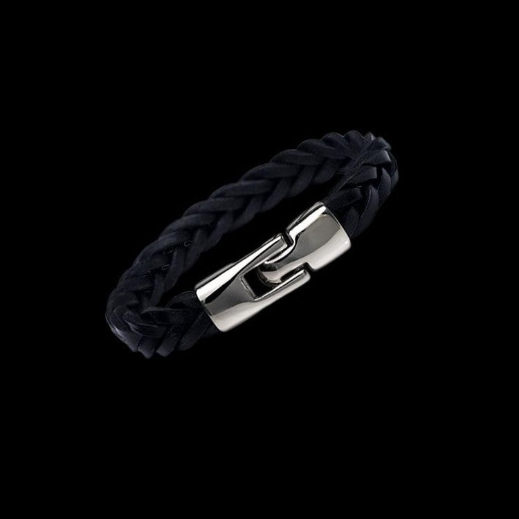 Black braided leather bracelet close-up with silver-tone rectangular buckle clasp.
