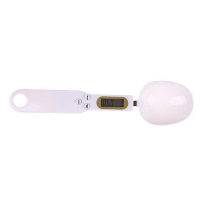 Digital kitchen scale with a white bowl on a white background