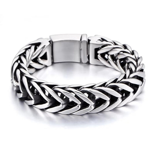 Silver braided bracelet on a white background