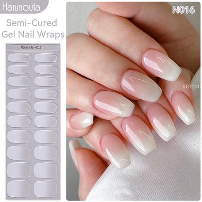 Harunouta semi-cured gel nail wraps with a hand displaying pink and white gradient nails.