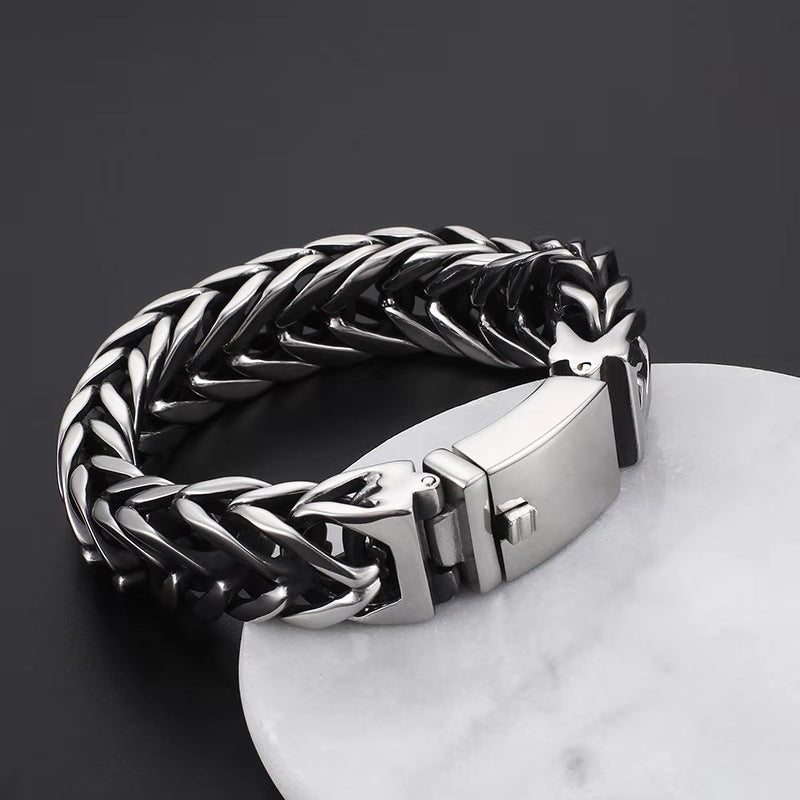 Chunky interlocking chain bracelet with rectangular box clasp, polished silver