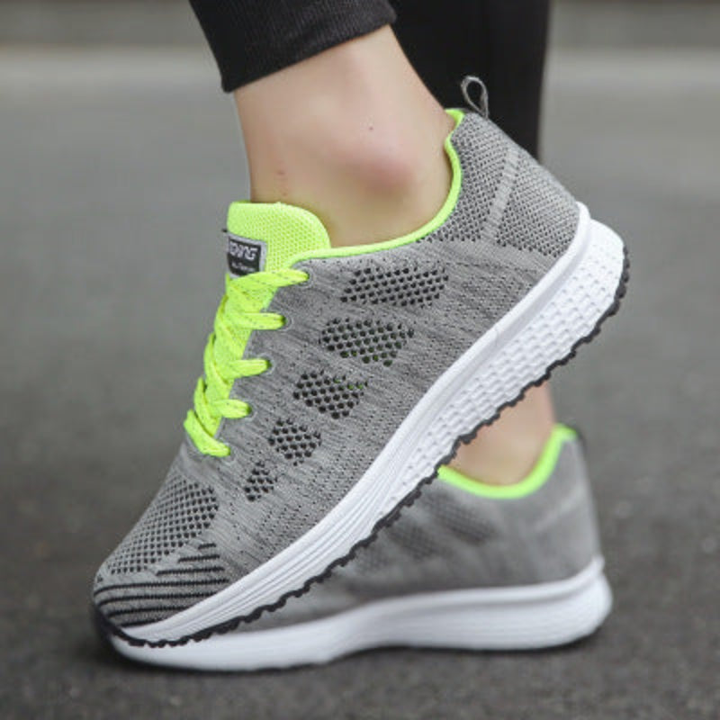 Women’s mesh sneakers, gray upper with neon green laces and white rubber outsole