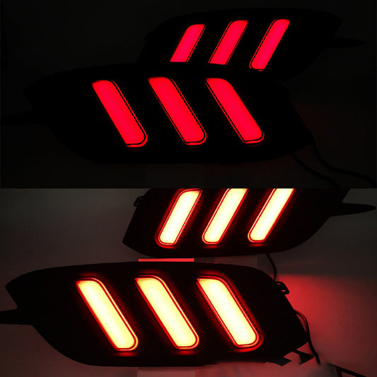 Two sets of LED car lights, one red and one yellow, on a dark background.