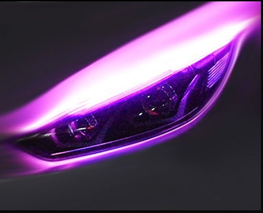 Car LED daytime running light strip close-up with bright purple-pink glow