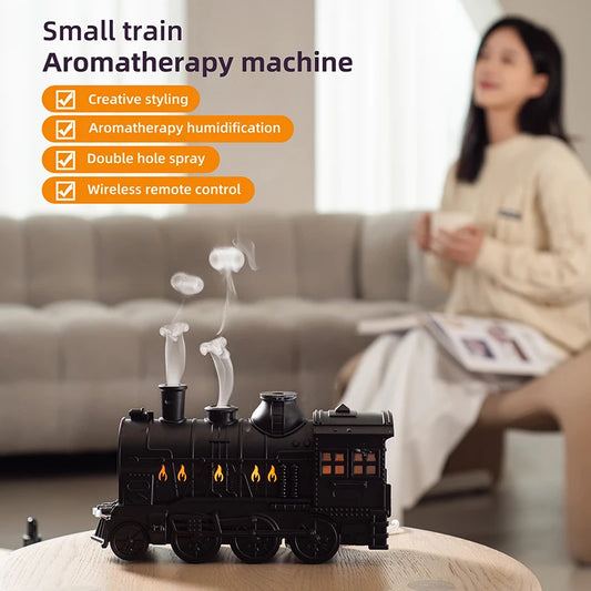 Small train aromatherapy machine with features listed, placed on a surface in a living room setting.