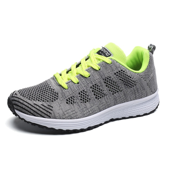 Breathable mesh sneakers, gray knit upper with neon green laces, lining, and white sole