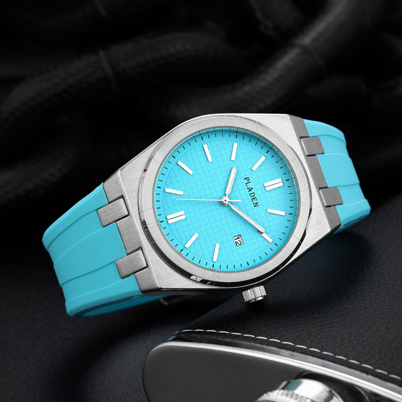 Men's quartz watch with turquoise silicone strap and teal dial, date window at 12