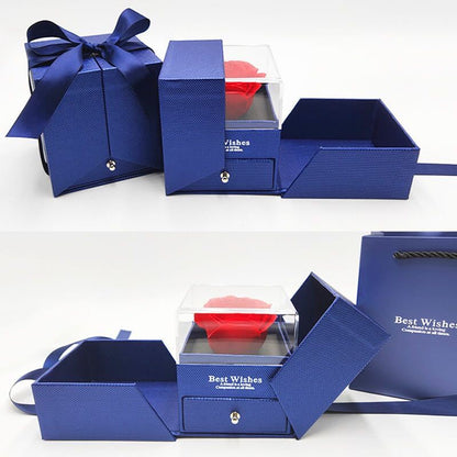 Blue rose jewelry gift box with clear rose compartment, folding trays, drawer, and ribbon-tied lid