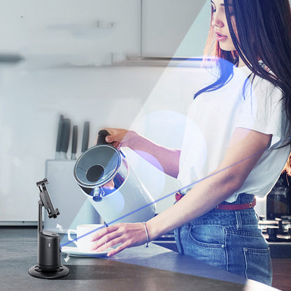Person using a kitchen appliance on a modern kitchen counter