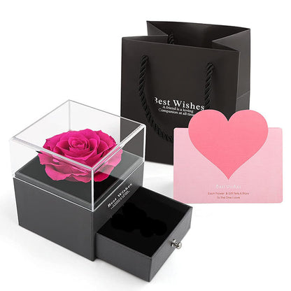 Acrylic jewelry gift box with fuchsia preserved rose in clear cube lid