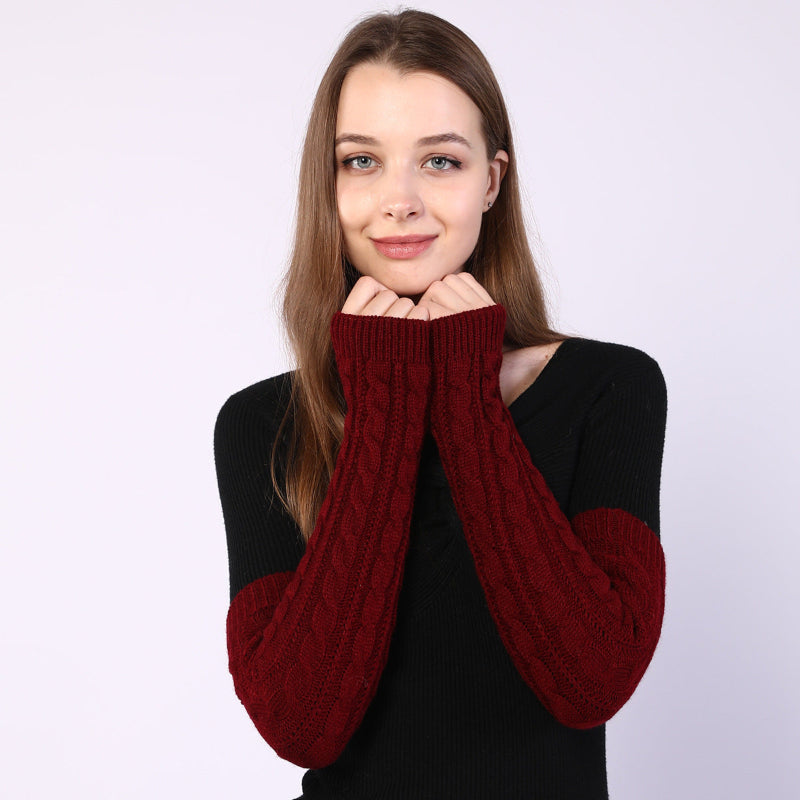 Twist-knit fingerless arm warmers in dark red, long sleeves with textured cable knit