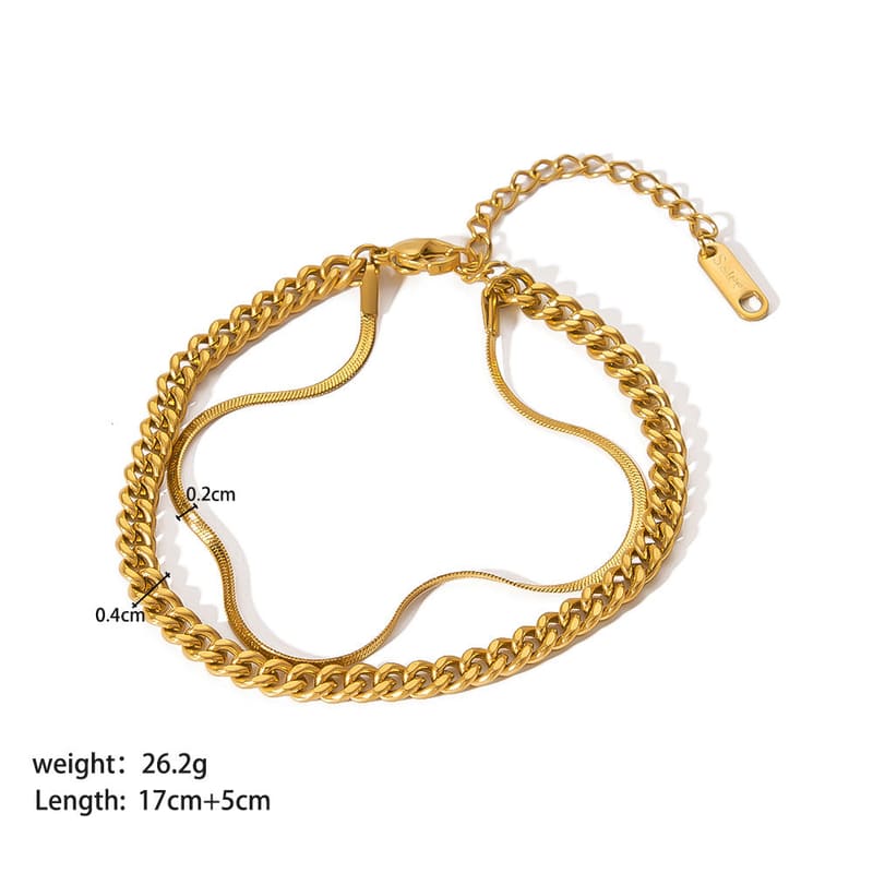 Gold-tone curb-chain ornament bracelet with linked charm accents and clasp