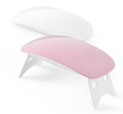 Pink portable USB LED nail lamp with white base, shown as a pair