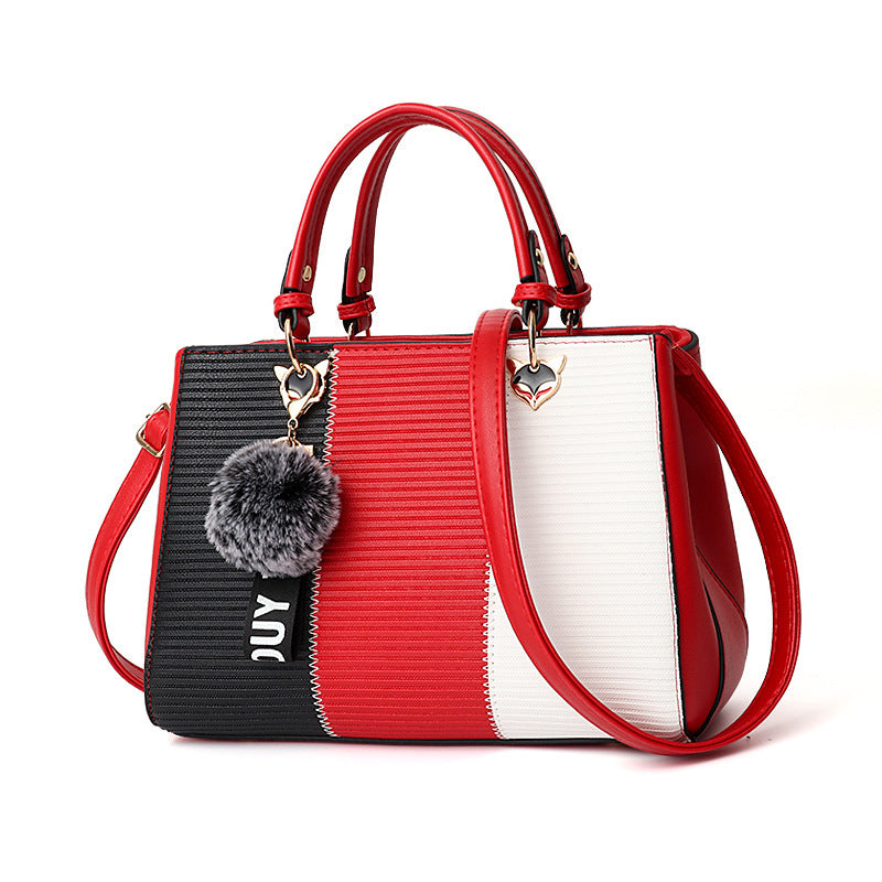 Color-block PU leather handbag with top handles, crossbody strap; red, black and white panels