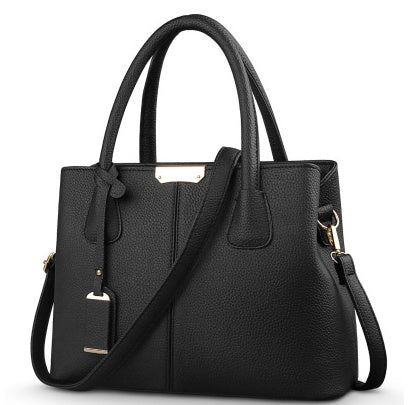 Black leather shoulder tote bag with gold-tone hardware and top handles