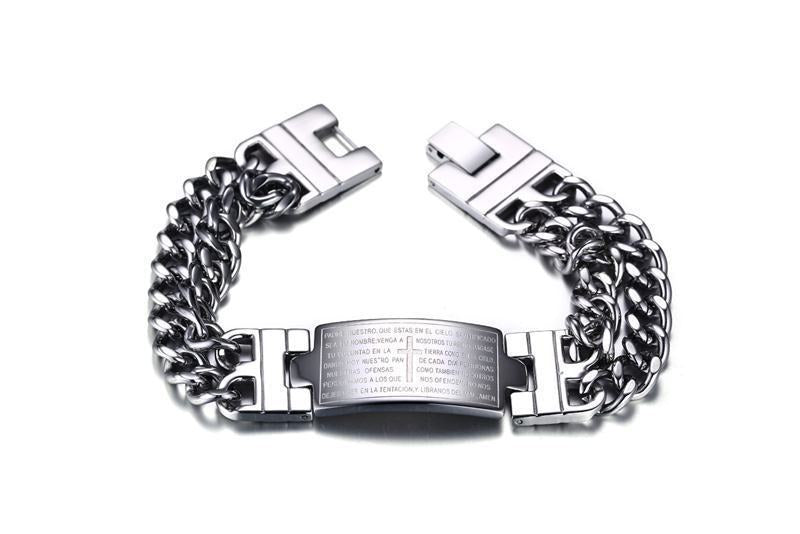 Silver chain bracelet with engraved text on a white background