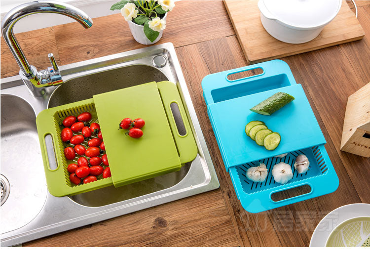 Green and blue cutting boards with vegetables on a kitchen counter.
