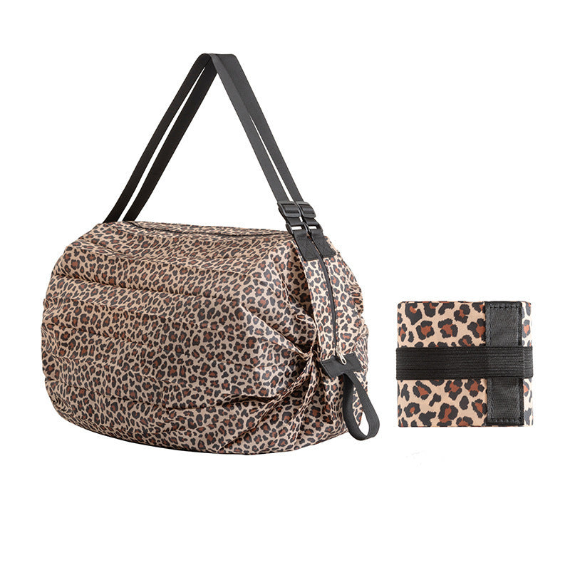 Leopard print bag and wallet on a white background