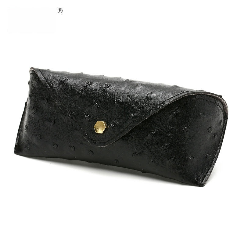 Black polka dot leather sunglasses case, curved flap with gold-tone clasp