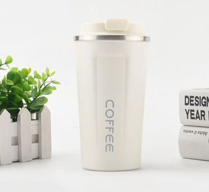 White coffee tumbler with 'COFFEE' text on a white background