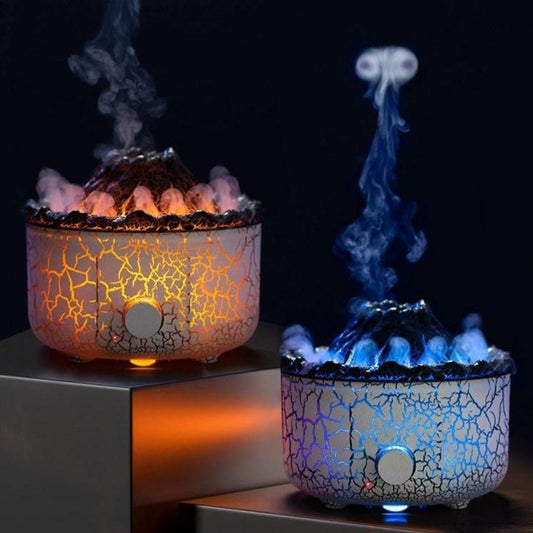 Two decorative lamps with cracked glass design, one emitting orange smoke and the other blue smoke, on a dark background.