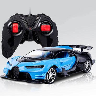 Blue toy car with black roof and a remote control on a light gray background