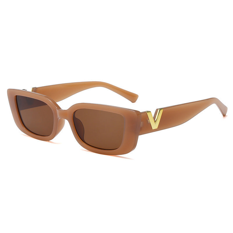 Square tan frame sunglasses with warm brown lenses and gold V temple detail