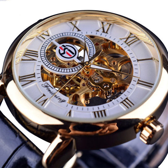 Gold wristwatch with visible mechanical components on a white background