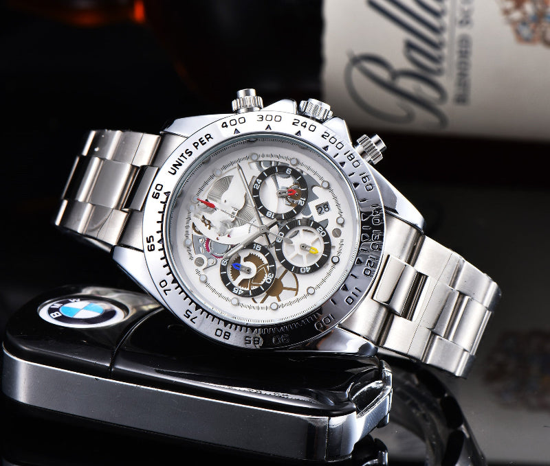 Men's quartz watch with steel link strap, white dial, gold-tone bezel.
