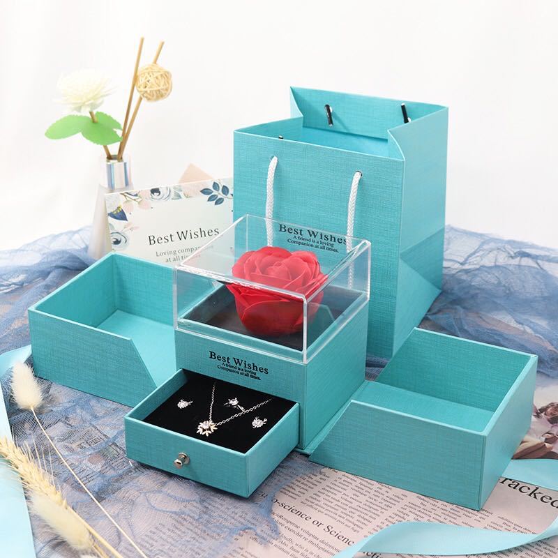Turquoise rose jewelry gift box with clear rose compartment, side trays, and a jewelry drawer