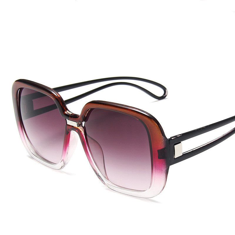 Sunglasses with a gradient purple lens on a white background