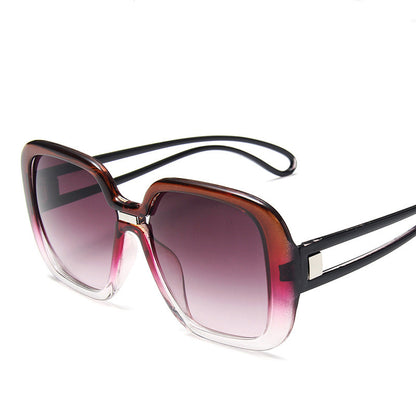 Sunglasses with a gradient purple lens on a white background