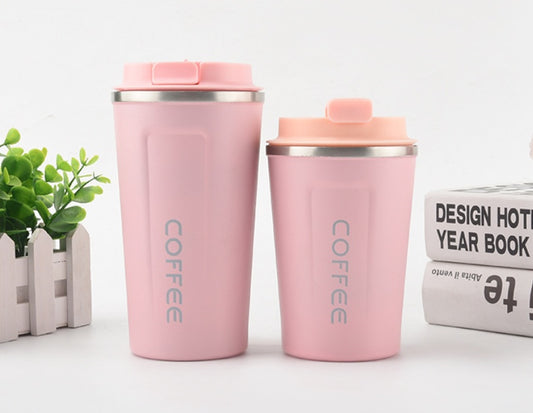 Two pink coffee tumblers with 'COFFEE' text on a light background.