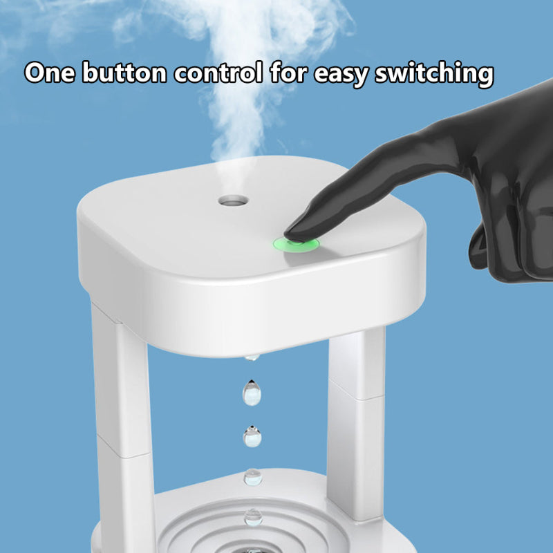 White humidifier with a green button being pressed, emitting steam against a blue background.