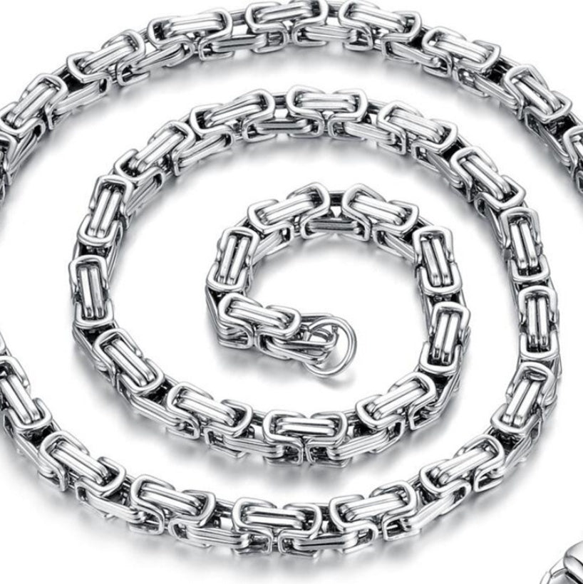 Silver chain necklace on a white background