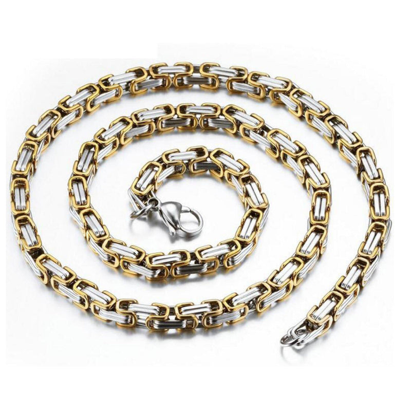 Gold and silver chain necklace on a white background