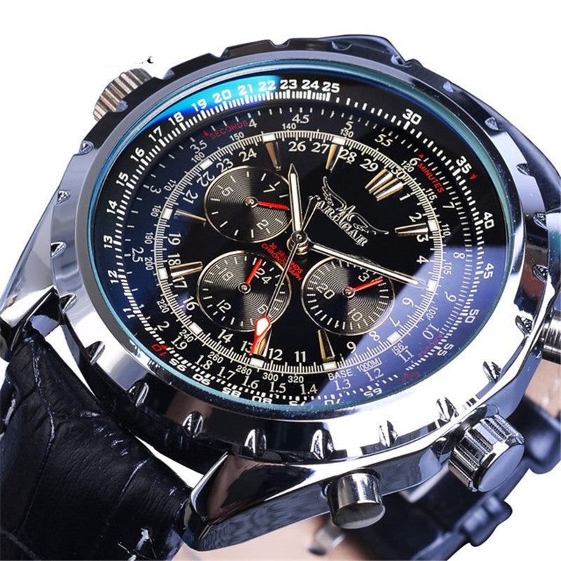 Close-up of a detailed wristwatch with a black strap on a white background