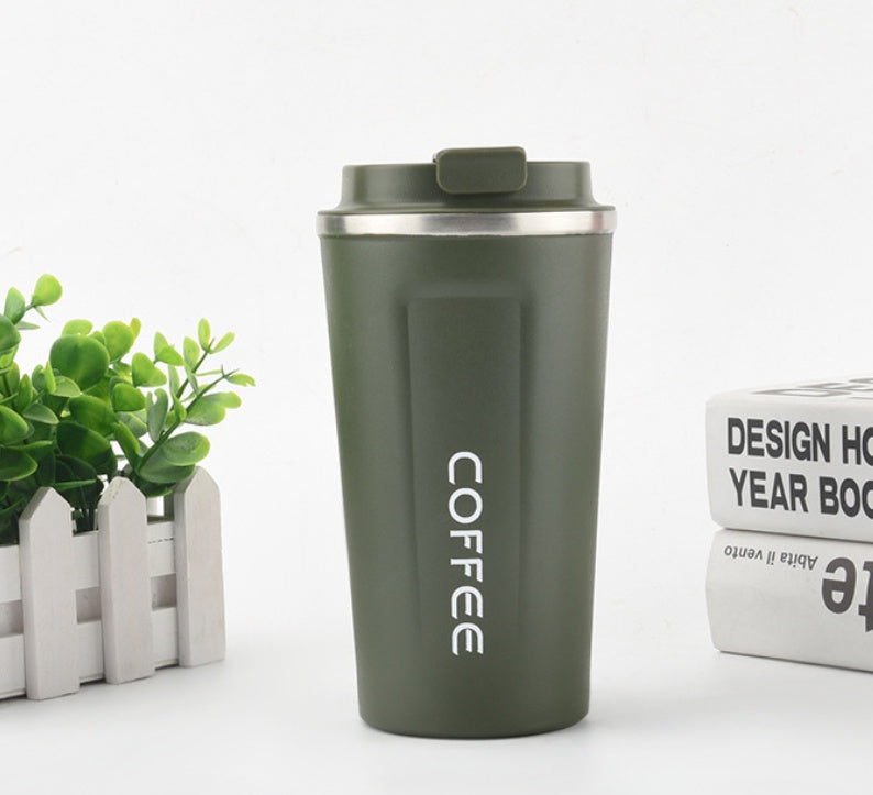 Green coffee tumbler with 'COFFEE' text on a white background