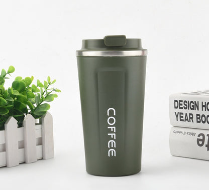Green coffee tumbler with 'COFFEE' text on a white background