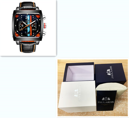 Black watch with orange accents on a white background, next to an open Paulareis watch box.