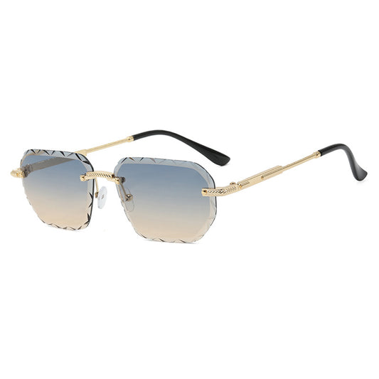 Sunglasses with gold frame and gradient lenses on a white background
