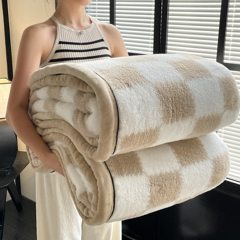 Velvet plaid blanket rolled, tan square blocks on white, plush texture and HOME label