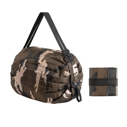 Camouflage duffel bag with strap and wrist wrap on a white background