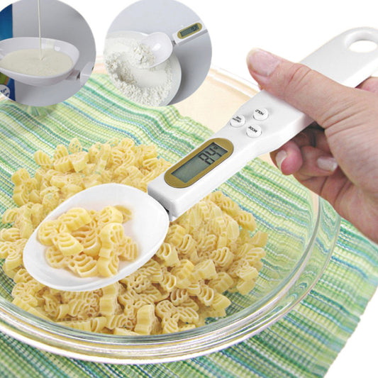 Digital measuring spoon with pasta and ingredients on a green and white striped tablecloth