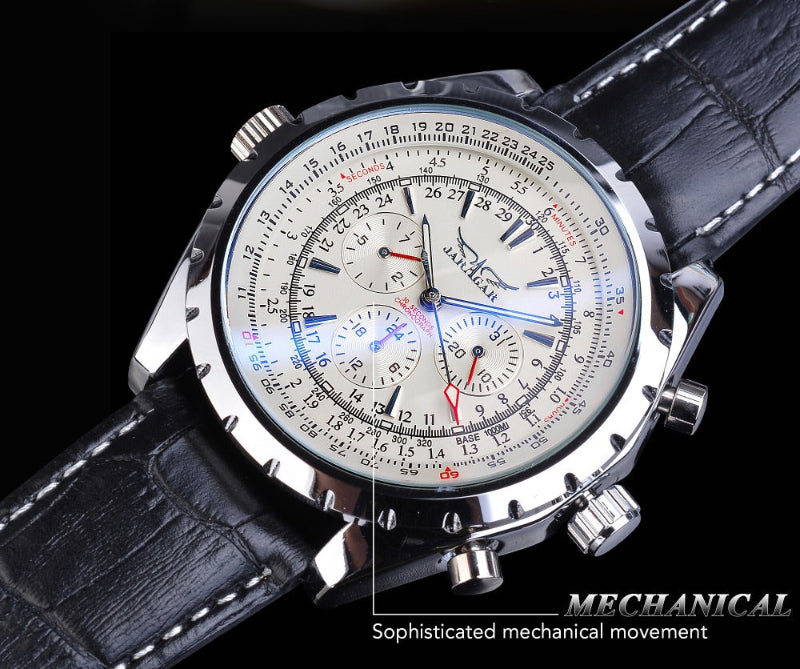 Mechanical watch with detailed face and black leather strap on a dark background